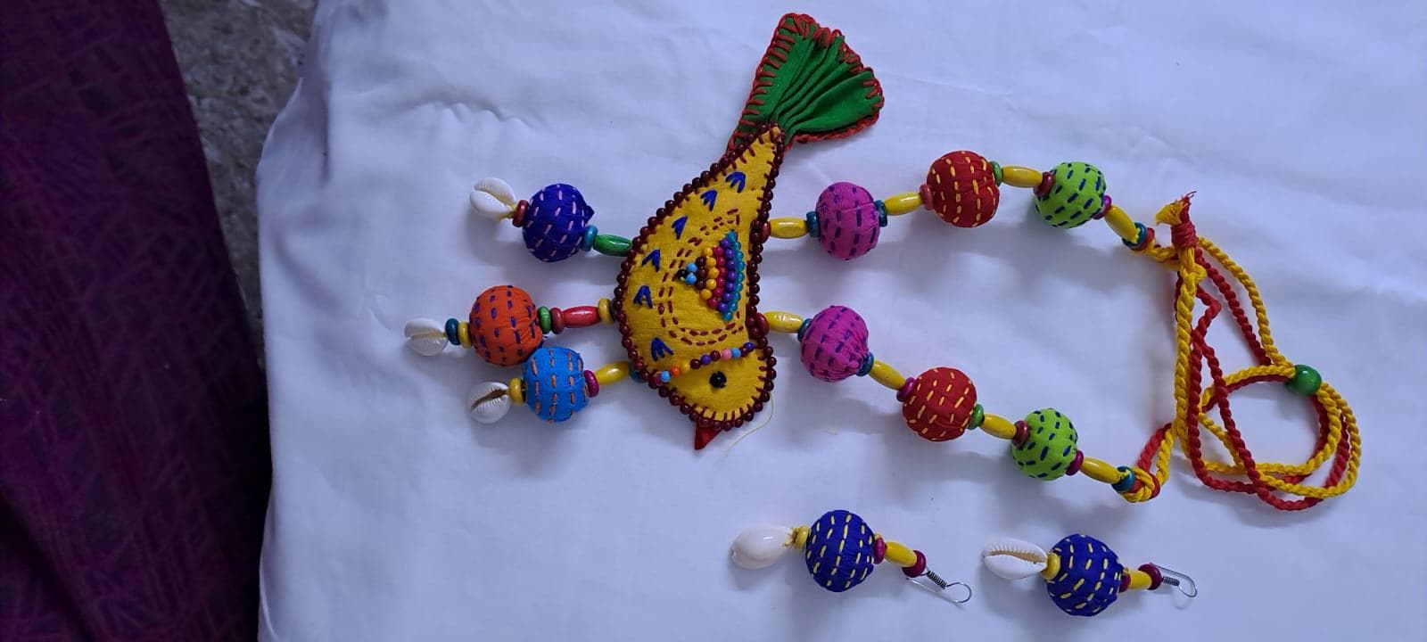 Exclusive fabric necklace with embroidered yellow fabric bird pendant and fabric beads n matching beads