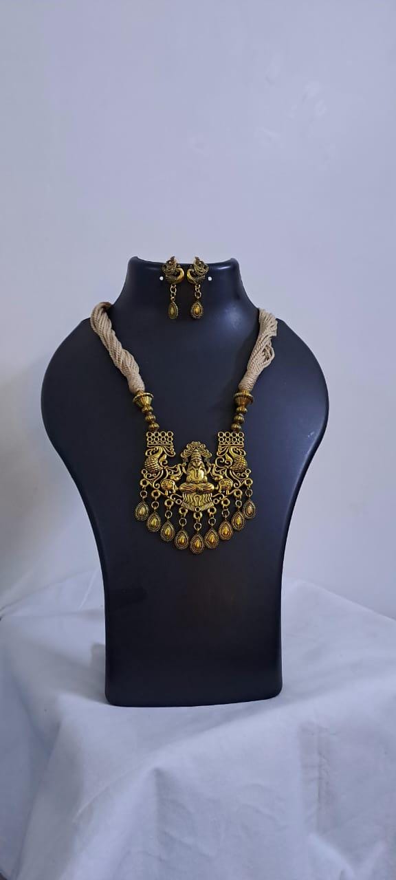 Off white thread necklace with Golden oxidised traditional pendant
