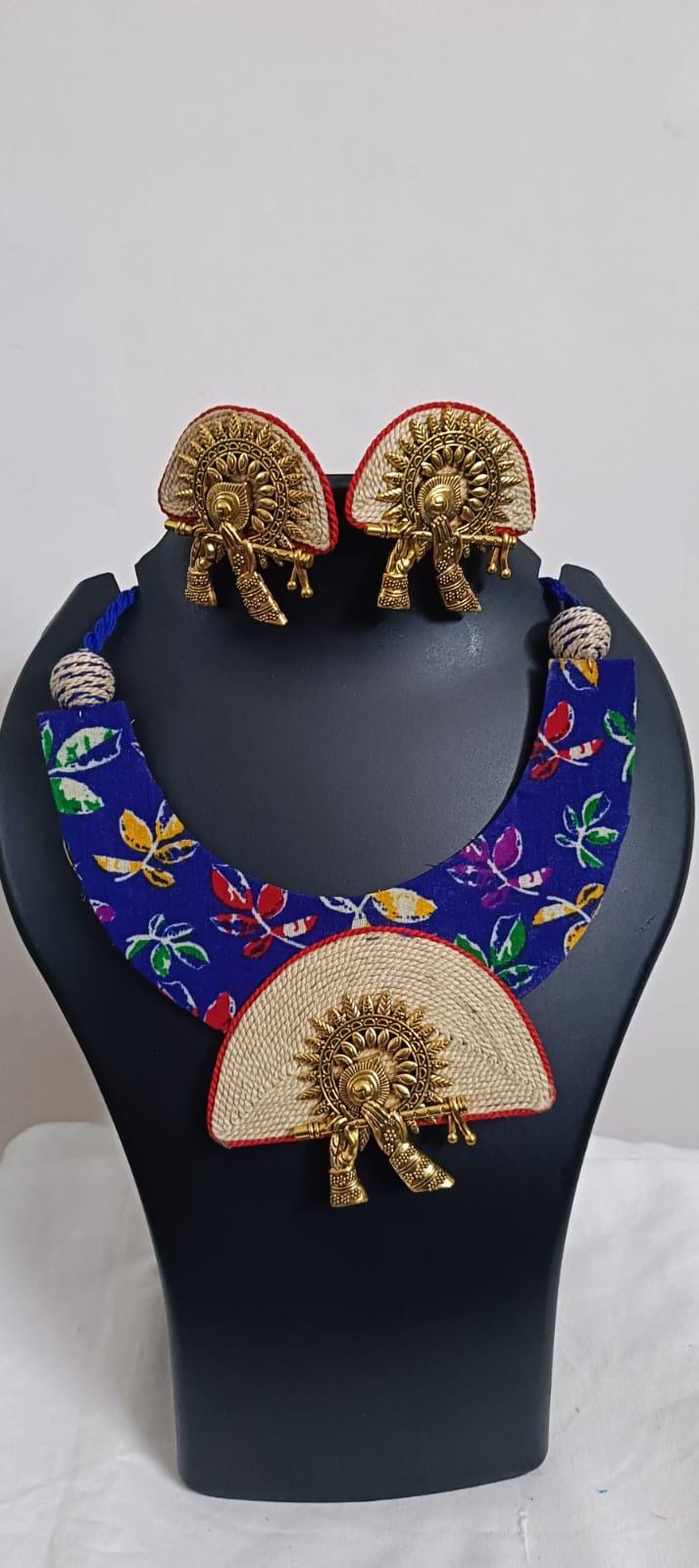 Unique fabric n thread necklace set with golden oxidised pendant and matching earrings