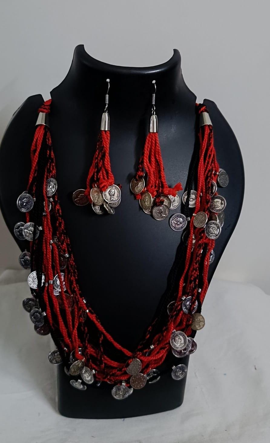 Exclusive multi-coloured and multi-layered thread necklace with silver oxidised charms