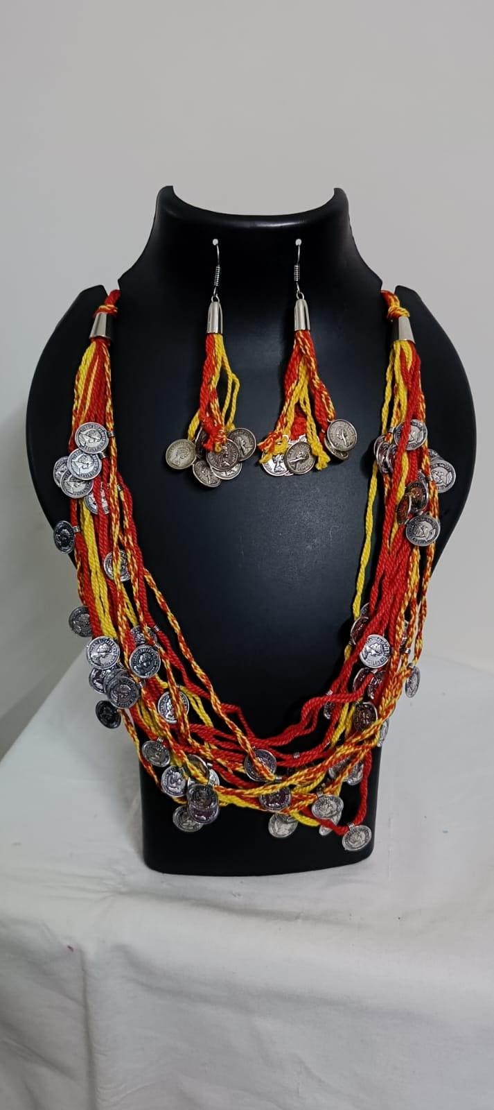 Exclusive multi-coloured and multi-layered thread necklace with silver oxidised charms