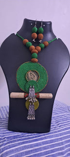 Exclusive green n brown thread beads necklace set with round thread n silver oxidised pendant n matching earrings