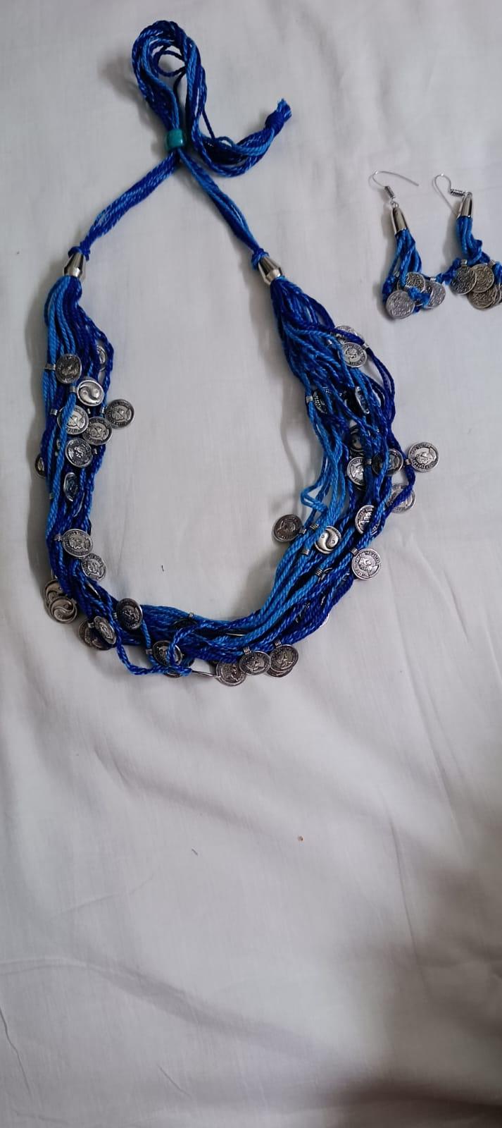 Exclusive multi-coloured and multi-layered thread necklace with silver oxidised charms