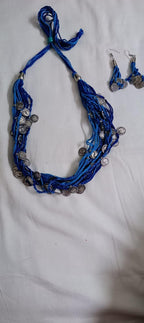 Exclusive multi-coloured and multi-layered thread necklace with silver oxidised charms