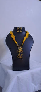 Yellow thread necklace with Golden oxidised traditional pendant
