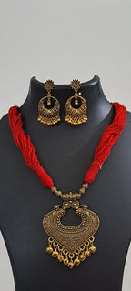 Red thread necklace with Golden oxidised traditional pendant