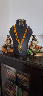 Orange seed beads necklace with Lord Ganesha pendant