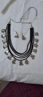 Exclusive multi layered  black glass beads necklace set with silver oxidised charms n matching earrings