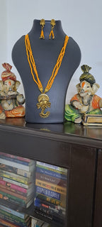 Orange seed beads necklace with Lord Ganesha pendant