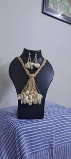 Multi layered jute necklace with shell fringes and with matching earrings.