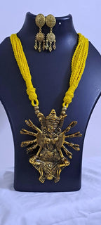 Yellow thread necklace with oxidised golden durga pendant