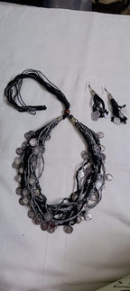 Exclusive multi-coloured and multi-layered thread necklace with silver oxidised charms