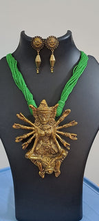 Green thread necklace with oxidised golden durga pendant