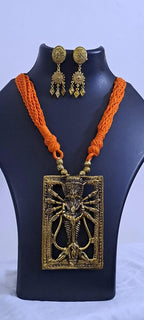 Orange thread necklace with oxidised golden durga pendant