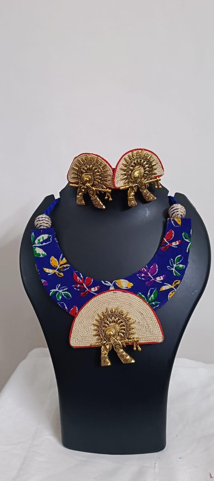 Unique fabric n thread necklace set with golden oxidised pendant and matching earrings