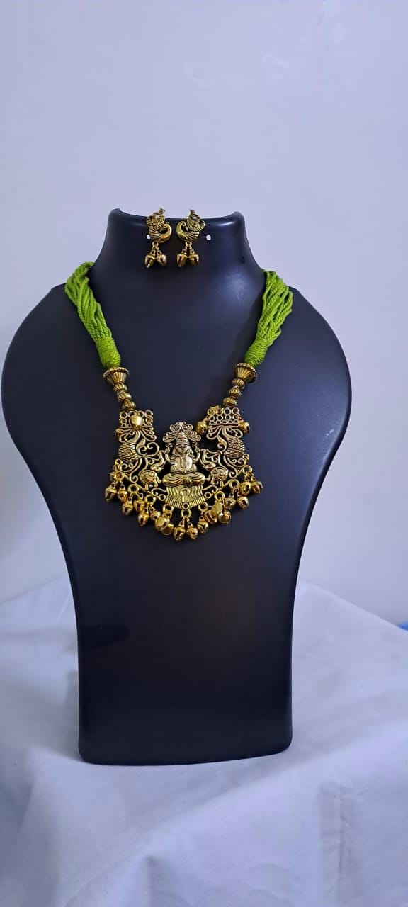 Light green thread necklace with Golden oxidised traditional pendant