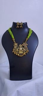 Light green thread necklace with Golden oxidised traditional pendant