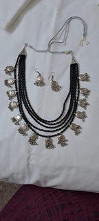 Exclusive multi layered  black glass beads necklace set with silver oxidised charms n matching earrings