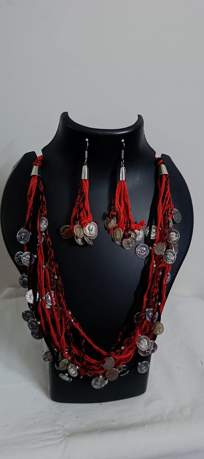 Exclusive multi-coloured and multi-layered thread necklace with silver oxidised charms