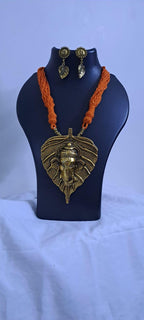 Orange thread necklace with golden oxidised ganesha pendant