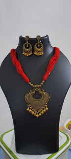 Red thread necklace with Golden oxidised traditional pendant