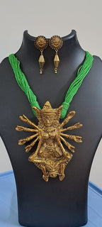 Green thread necklace with oxidised golden durga pendant