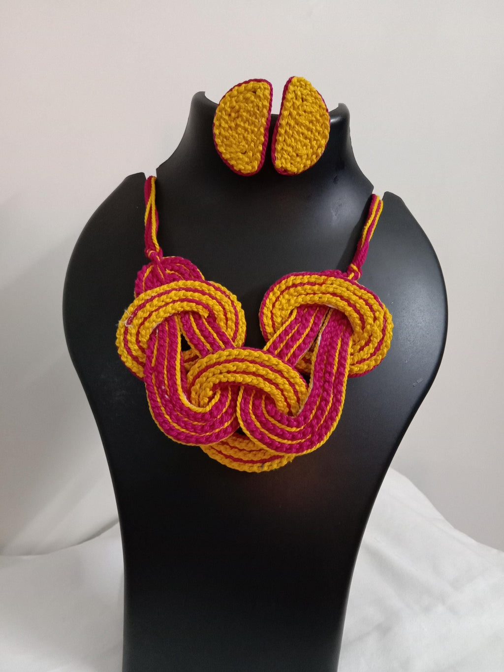 Celtic knot thread necklace with matching thread earrings.