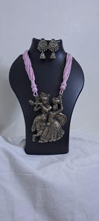 Radha Krishna silver oxidised pendant necklace in pink thread with matching earrings
