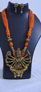 Orange thread necklace with oxidised golden durga pendant