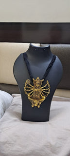 Black thread necklace with oxidised golden durga pendant