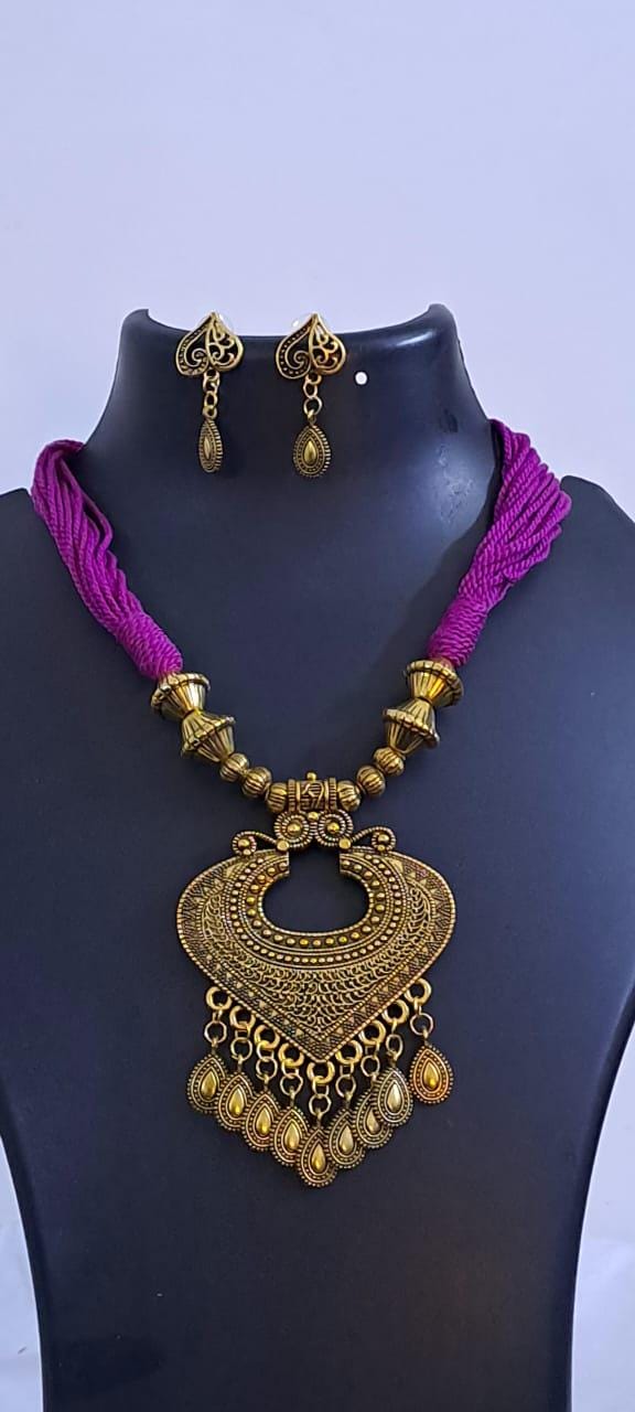 Purple thread necklace with Golden oxidised traditional pendant