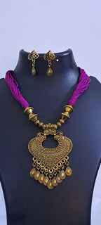 Purple thread necklace with Golden oxidised traditional pendant