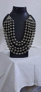 Multi-layered silver oxidised beads necklace .
