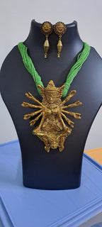 Green thread necklace with oxidised golden durga pendant