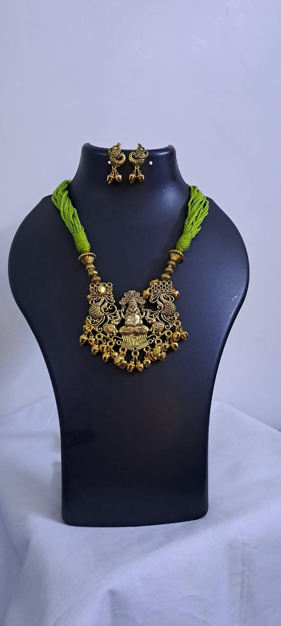 Light green thread necklace with Golden oxidised traditional pendant