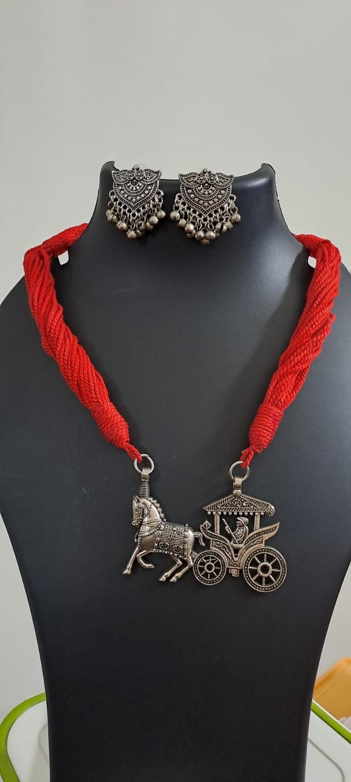 Red thread necklace with silver oxidised traditional pendant