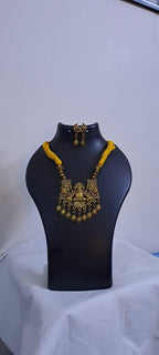 Yellow thread necklace with Golden oxidised traditional pendant
