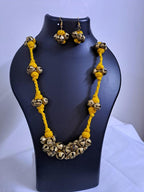 Yellow thread necklace with trinkets n matching earrings