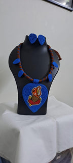 Exclusive brown and blue thread necklace with leaf shaped  Ganesha thread pendant and matching earrings.