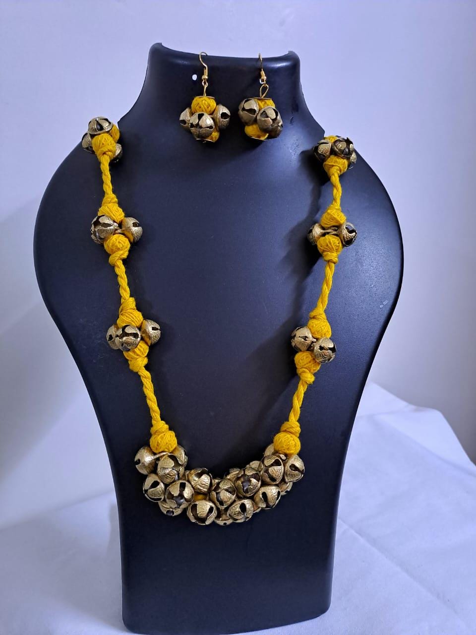 Yellow thread necklace with trinkets n matching earrings