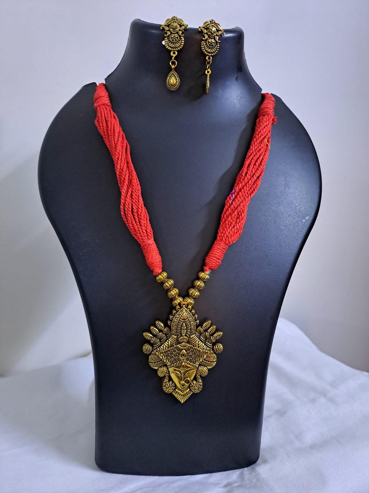 Red thread jewellery set with golden durga pendant n matching earrings