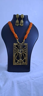 Orange thread necklace with oxidised golden durga pendant