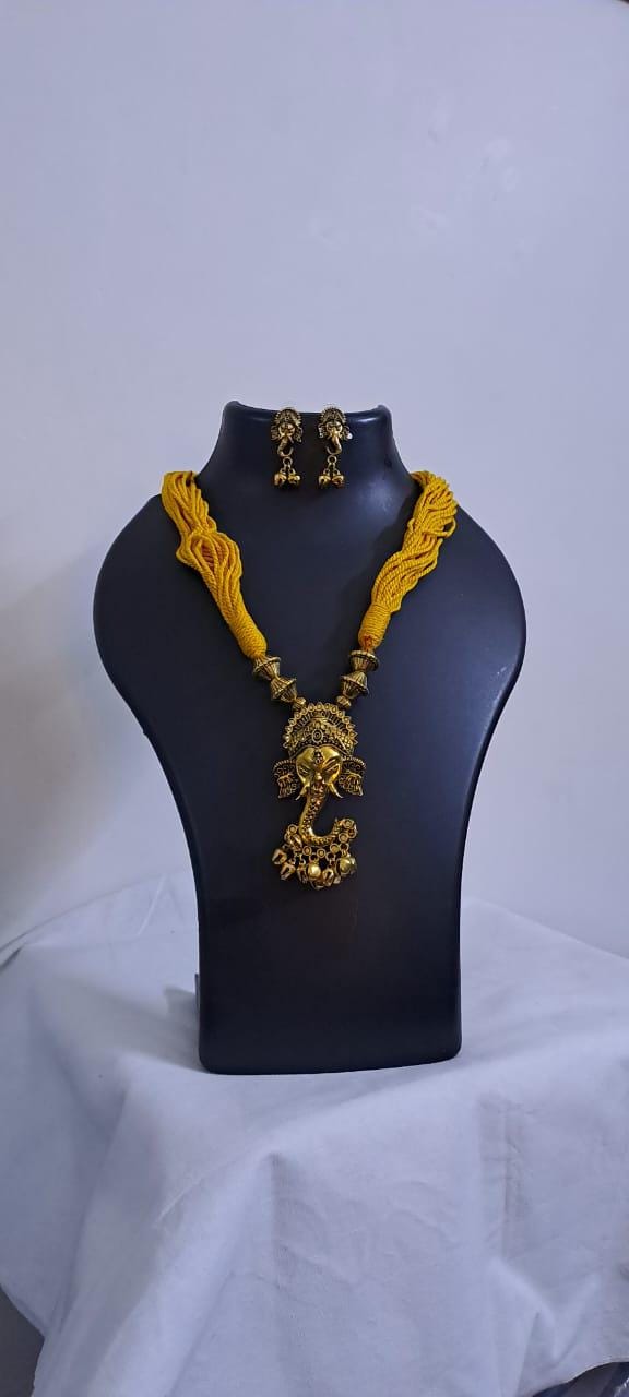 Yellow thread necklace with Golden oxidised traditional pendant