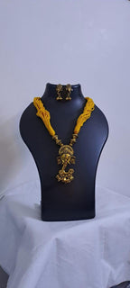 Yellow thread necklace with Golden oxidised traditional pendant
