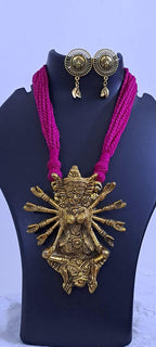 Pink thread necklace with oxidised golden durga pendant
