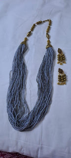 Exclusive multi layered  grey glass beads necklace set with golden oxidised matching earrings