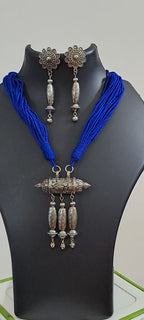 Blue thread necklace with silver oxidised traditional pendant