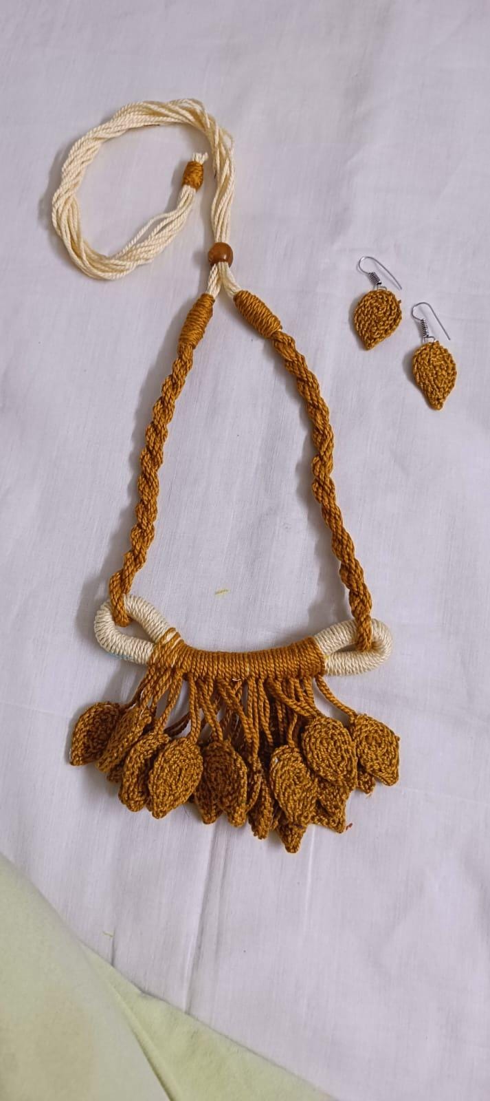 Golden brown Crochet thread necklace set with leaf fringes and matching earrings