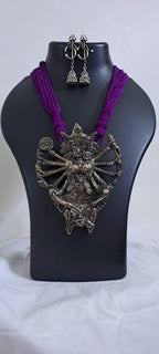 purple thread necklace with oxidised golden durga pendant