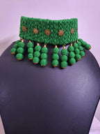 Green braided choker necklace set with fringes and matching earrings